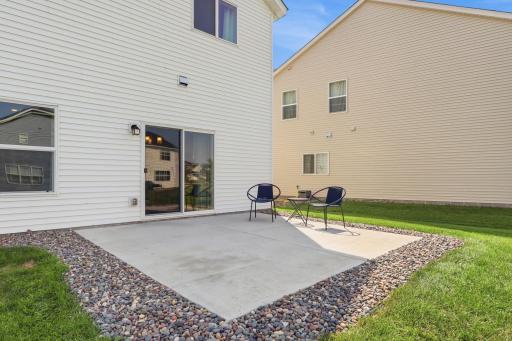 Walkout patio that leads to dining room and kitchen