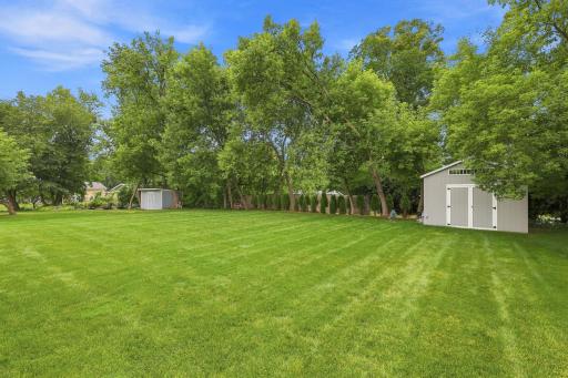 Well manicured lawn with sprinklers!