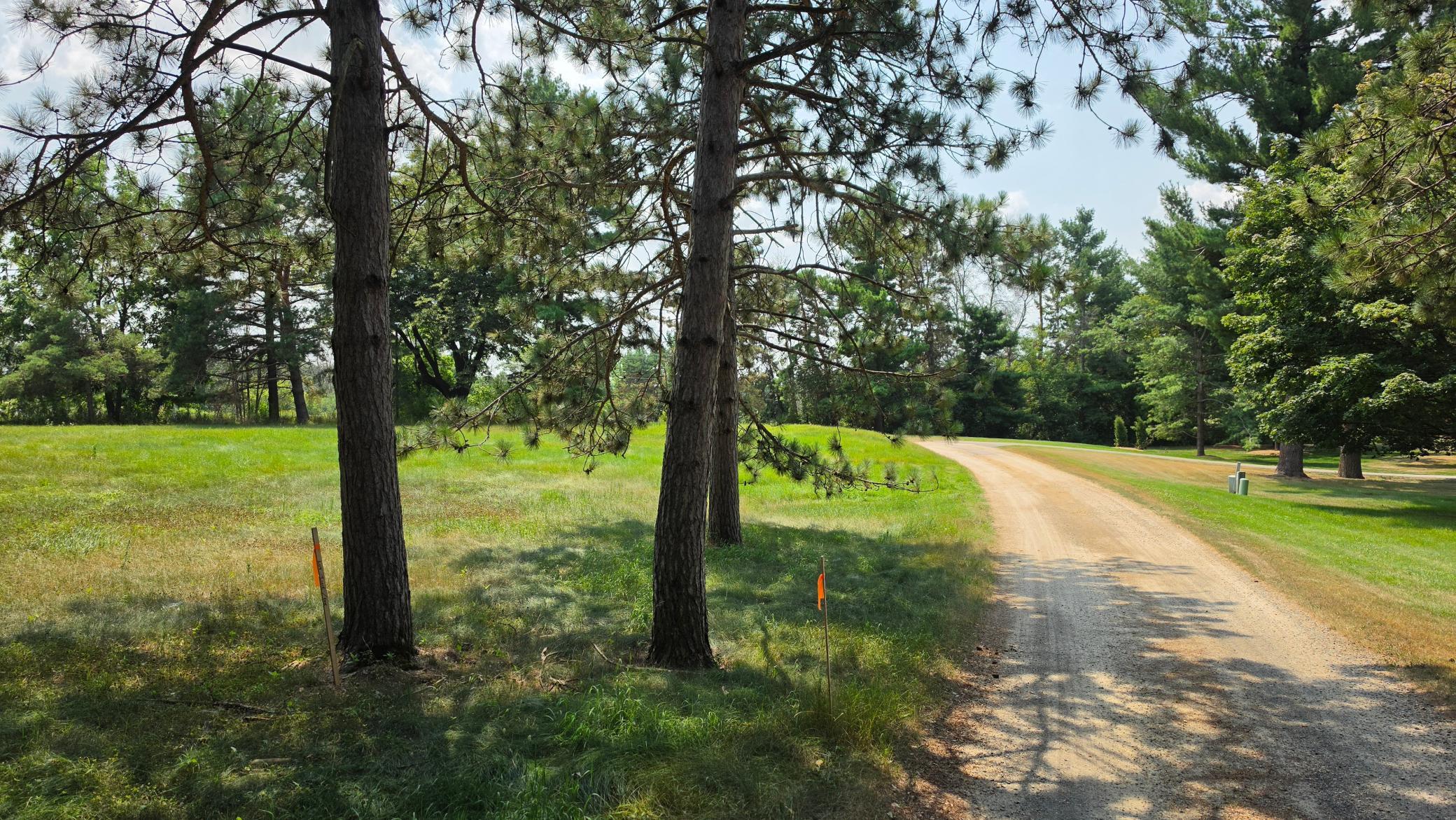 Private roadway. Lot 1 is on the left, beyond the survey stakes in the foreground