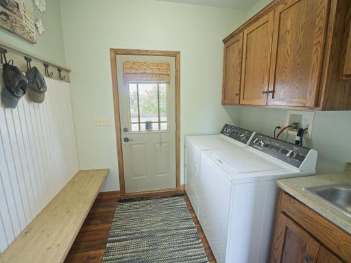 The laundry has cupboard space above a sink!
