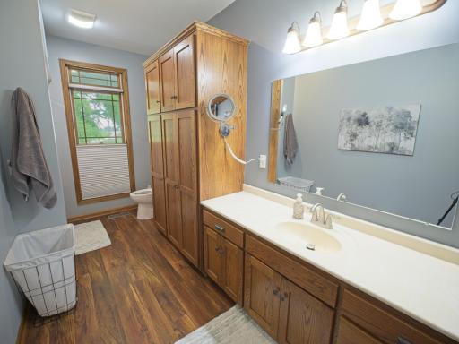 A full bath off of the owner's suite with tons of cupboards for towels and linens!