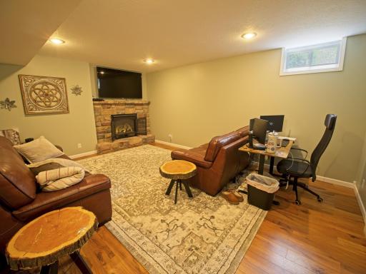 The lower level family room has a fireplace too!