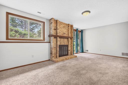 Walkout to the front yard! Family room with real brick fireplace!