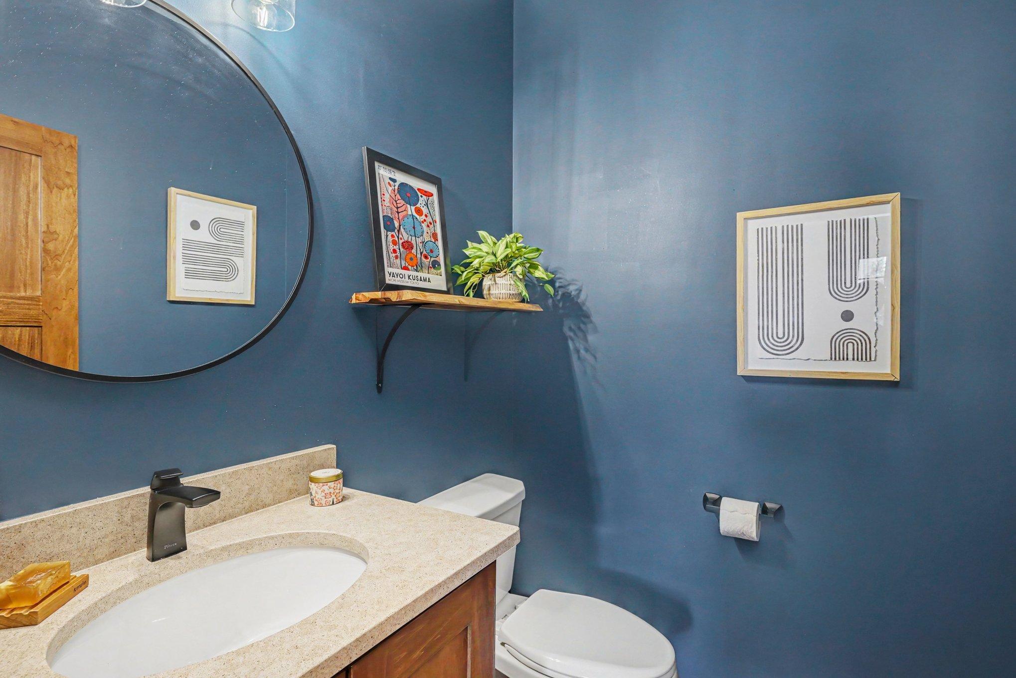 The half bath is conveniently located between the foyer and access to the mud room and garage.