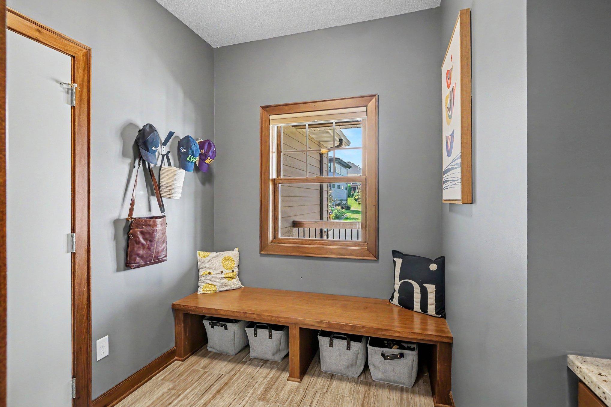 The mud room has a bench seat, hooks and a built-in desk area to put your keys, purse, etc. The 3 car garage has a utility sink and has epoxy flooring. The 3rd stall does have an extra bump-out for extra storage.