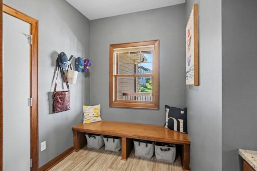 The mud room has a bench seat, hooks and a built-in desk area to put your keys, purse, etc. The 3 car garage has a utility sink and has epoxy flooring. The 3rd stall does have an extra bump-out for extra storage.