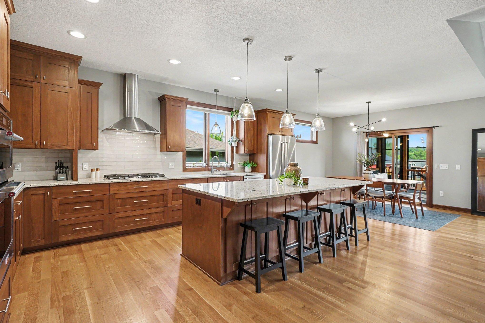 The custom kitchen offers loads of cabinet space with pull-outs, a lazy susan and a large pantry.