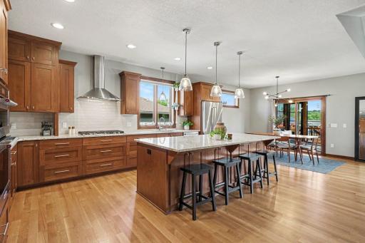 The custom kitchen offers loads of cabinet space with pull-outs, a lazy susan and a large pantry.