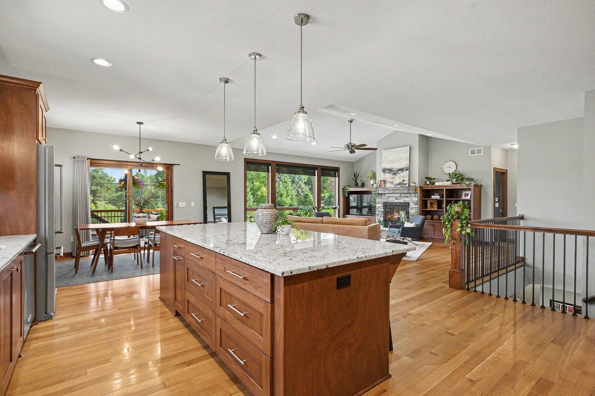 The kitchen offers a great space for entertaining with the open-concept floorplan. The island has three pendant lights as well as recessed lighting.