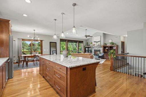 The kitchen offers a great space for entertaining with the open-concept floorplan. The island has three pendant lights as well as recessed lighting.