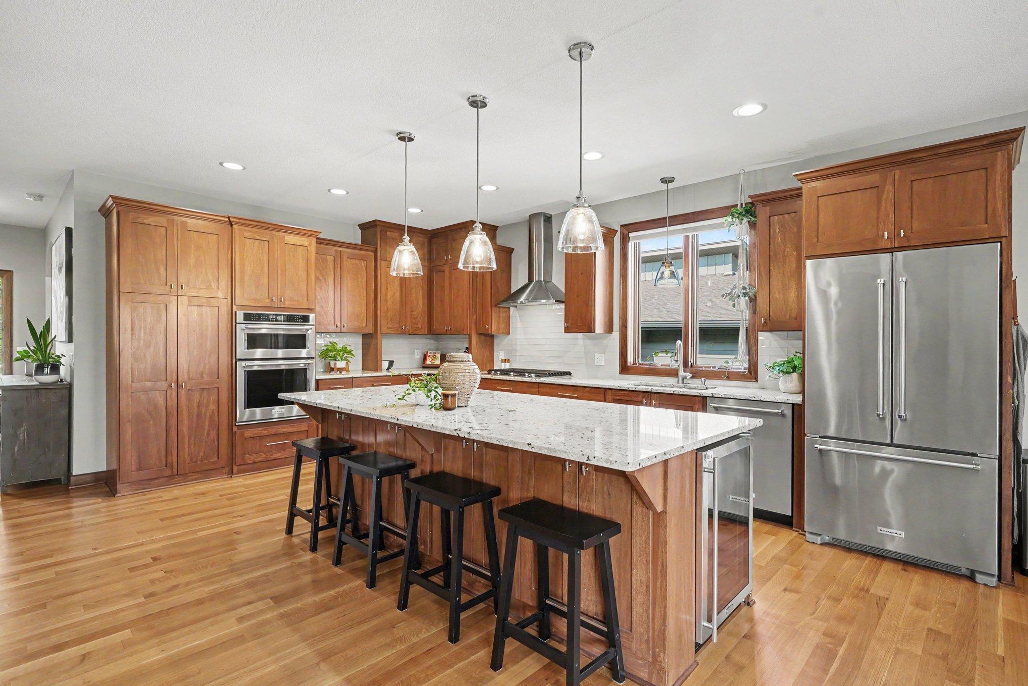 The island offers seating and storage on both sides! There is a convenient beverage/wine cooler built-in on the island.