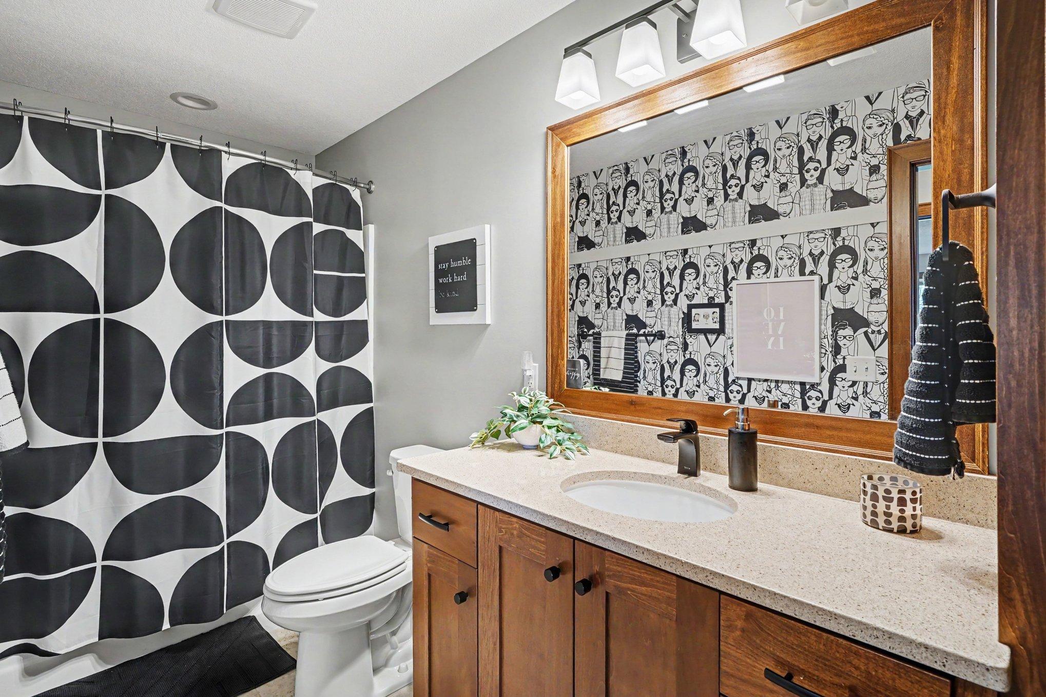 The full lower level bathroom finishes off this level.