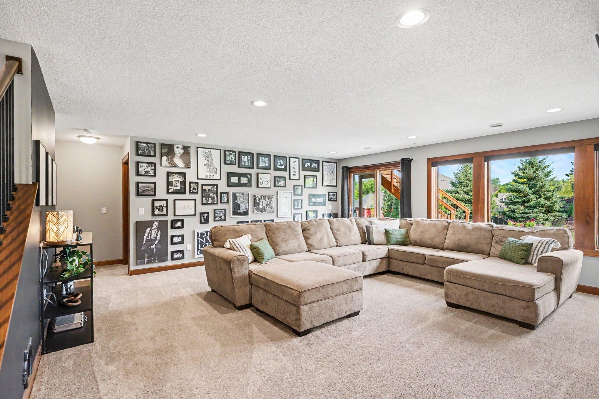 The lower level offers so much light with a triple window with new roller blades and a sliding glass door leading to the patio and backyard. This doesn't feel like a basement at all!