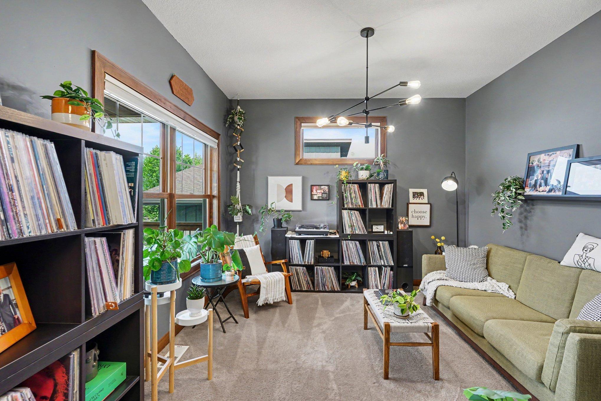 The homeowners are using their office as a music room with seating.