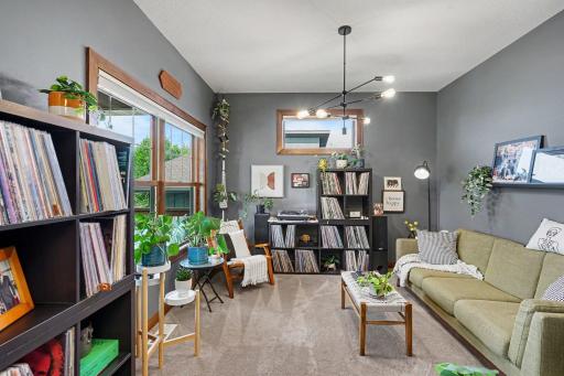 The homeowners are using their office as a music room with seating.