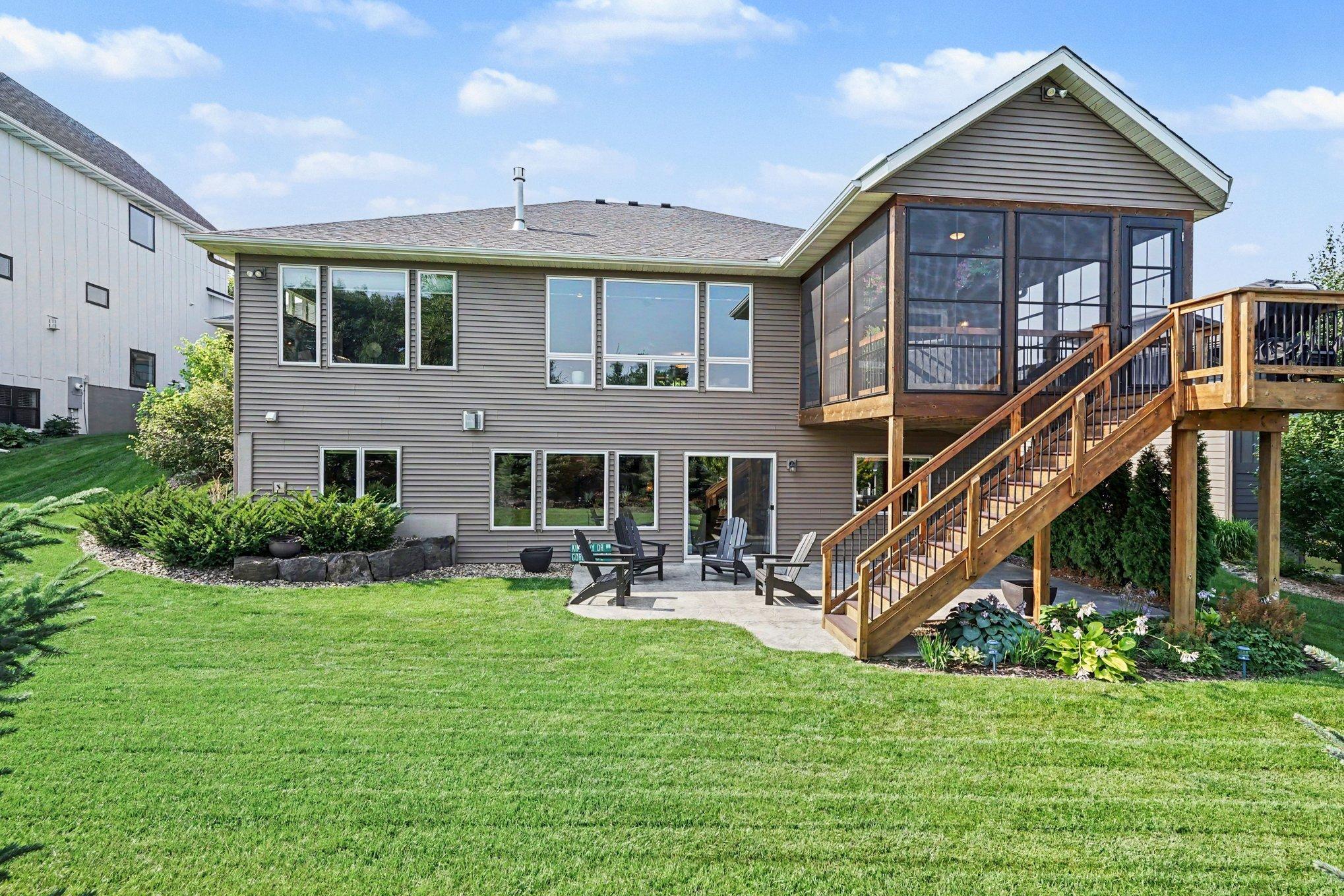 Beautifully landscaping backyard offers privacy with low maintenance perennials throughout.