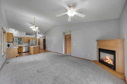 Soaring vaulted ceilings greet you upon entry throughout the kitchen/dining/living rooms as well as the owner's suite on main level.