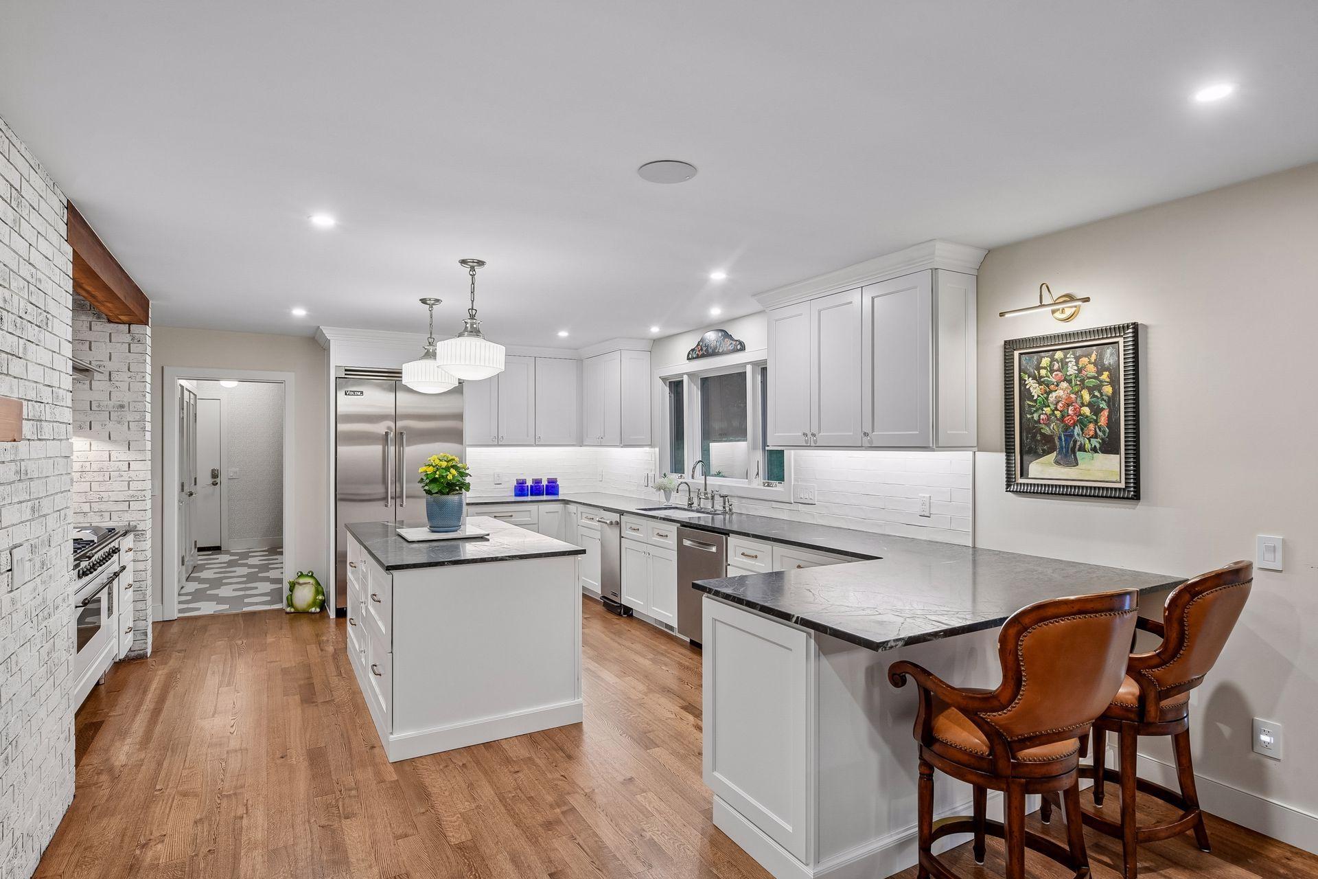 Customized cabinetry and soapstone countertops elevate the chef’s kitchen