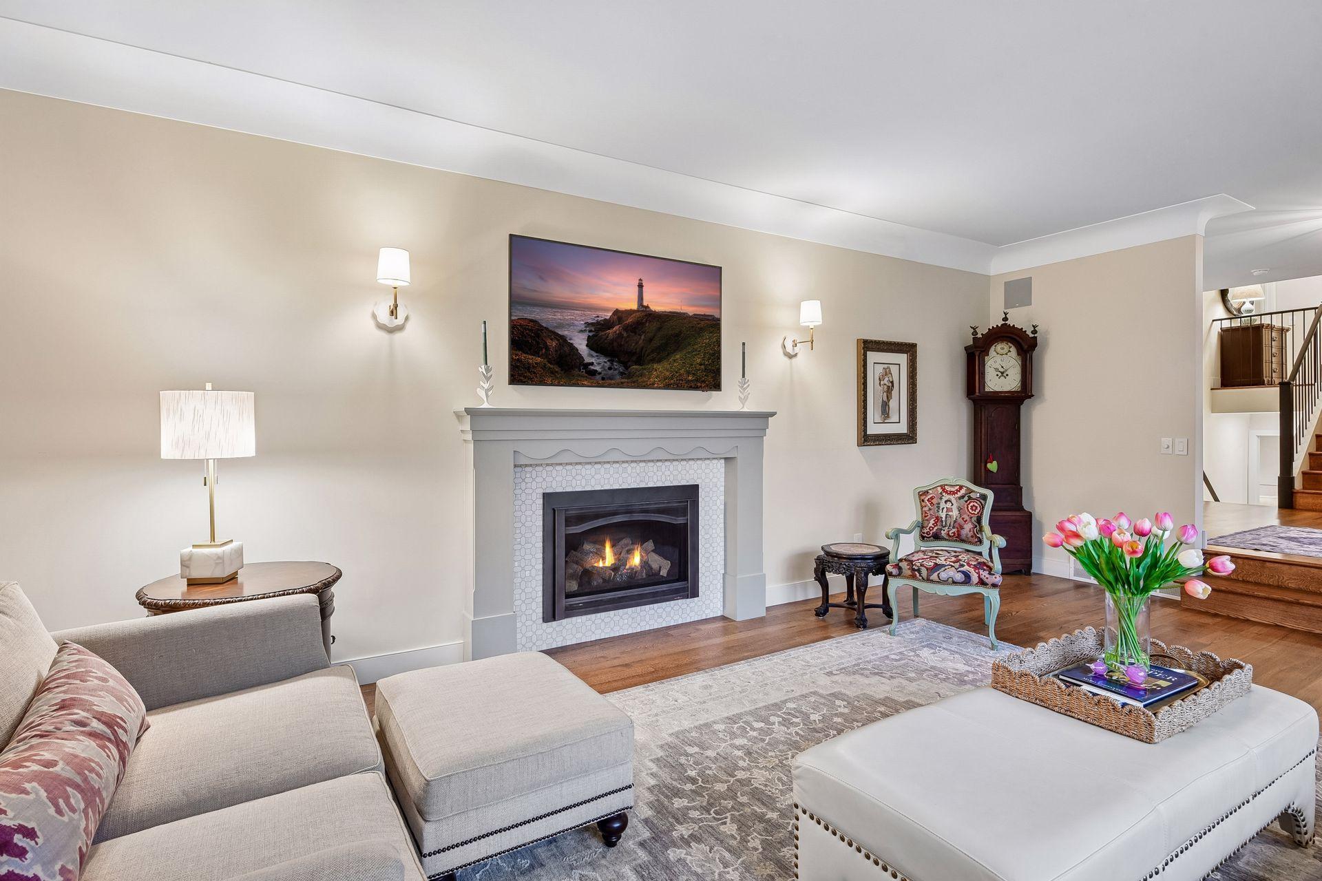 Inviting living room anchored by a custom marble fireplace