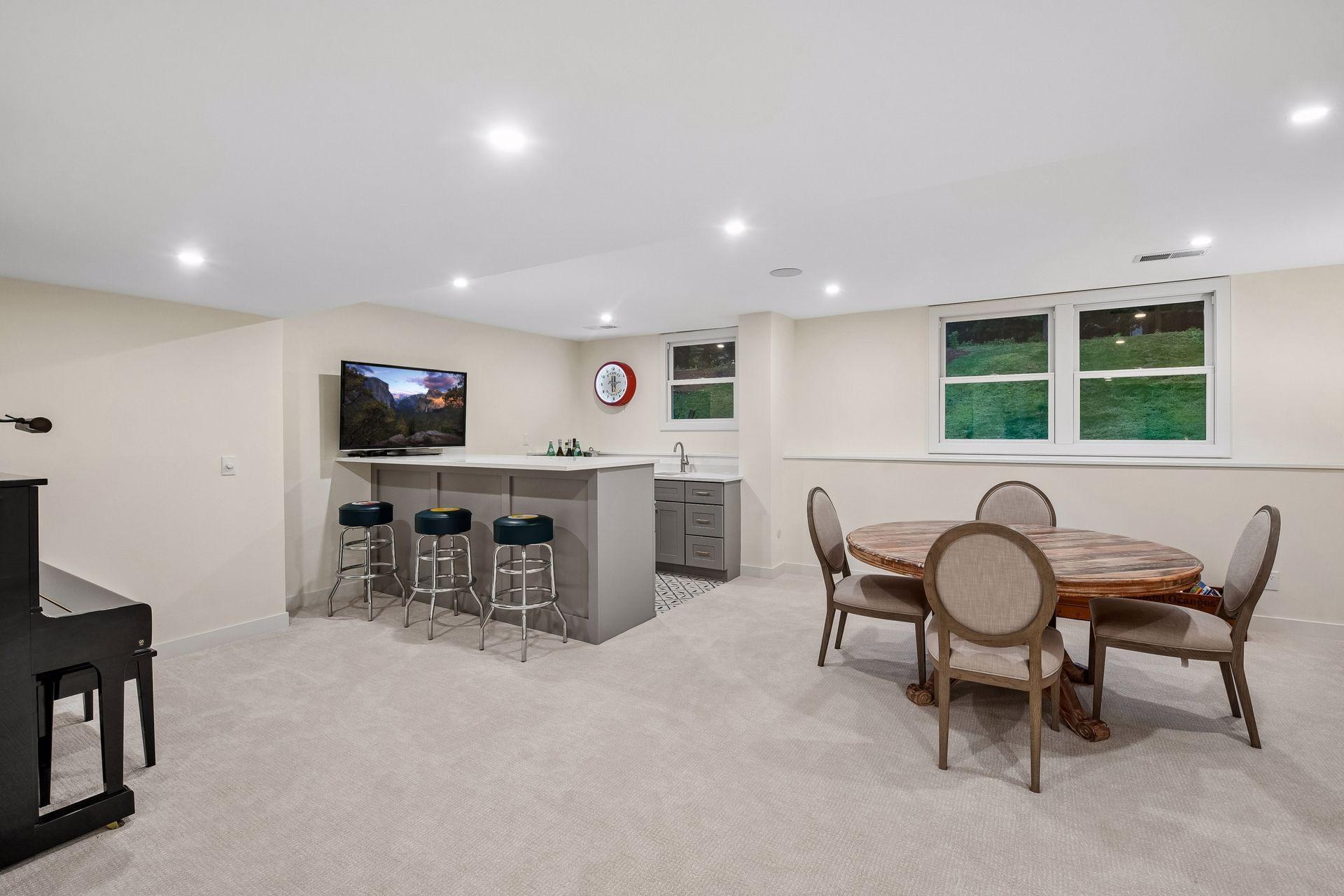 Expansive lower level offers flexible gathering and entertaining spaces