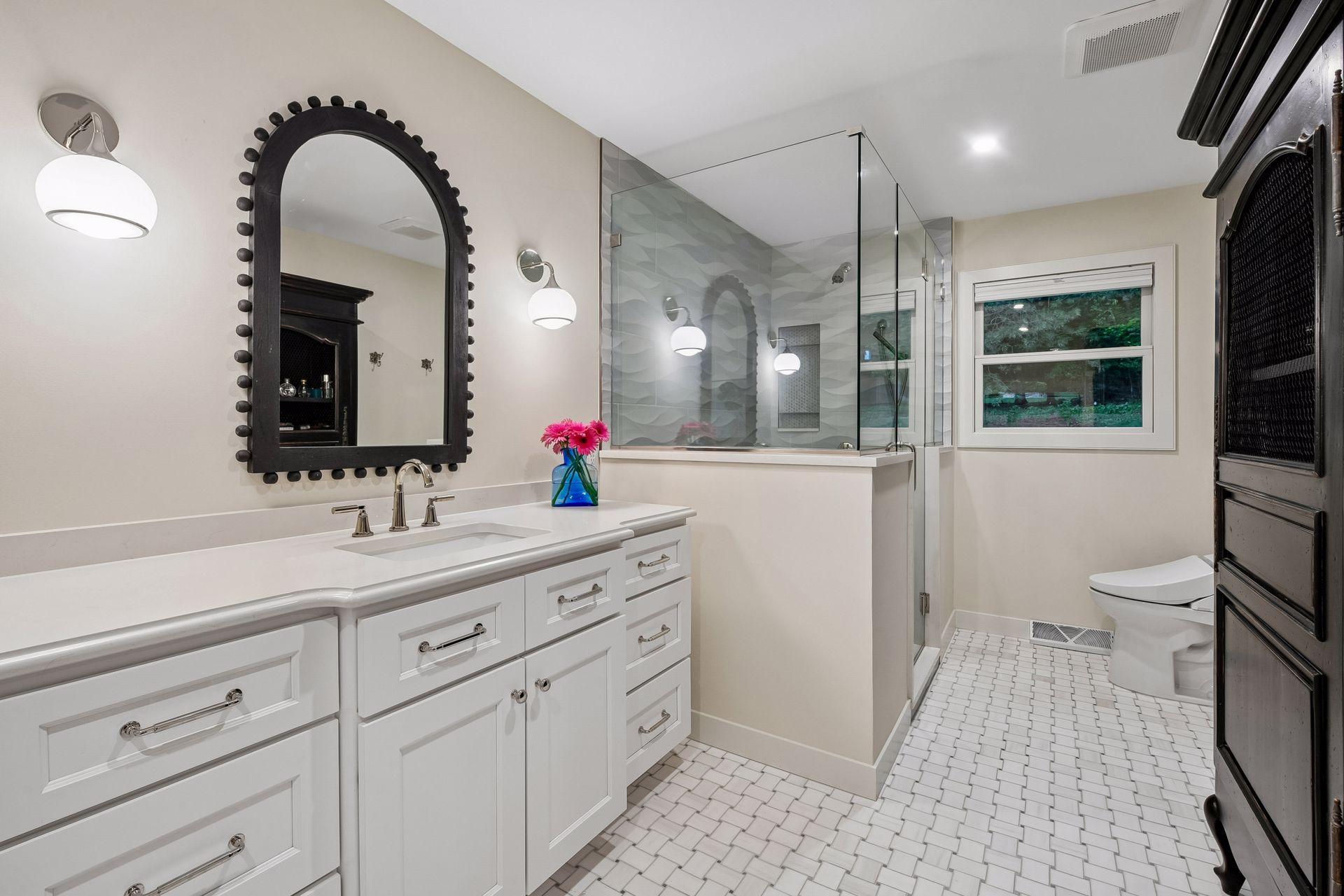 Luxurious primary bath features an oversized custom tiled shower