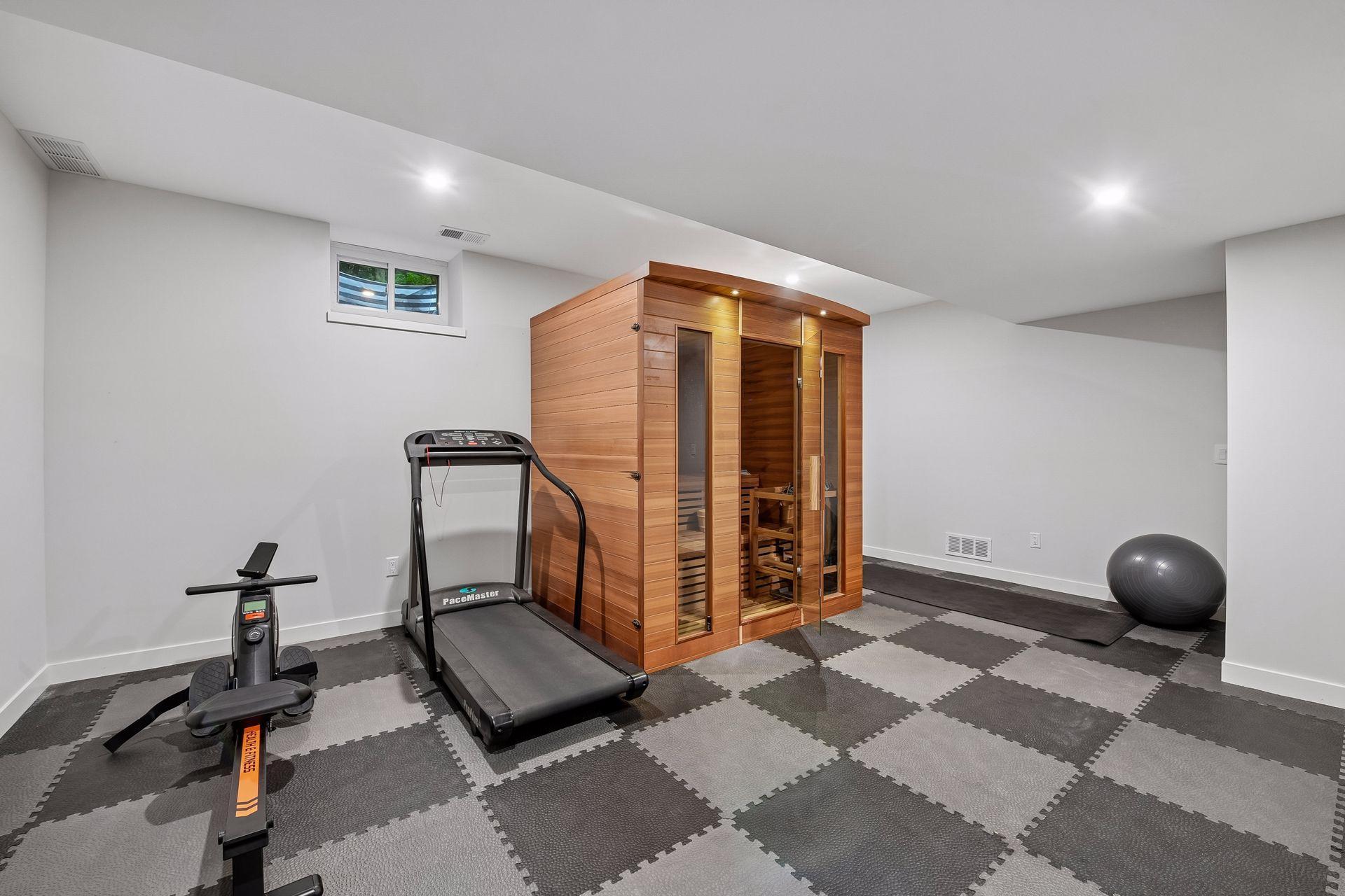 Dedicated exercise room features a private sauna