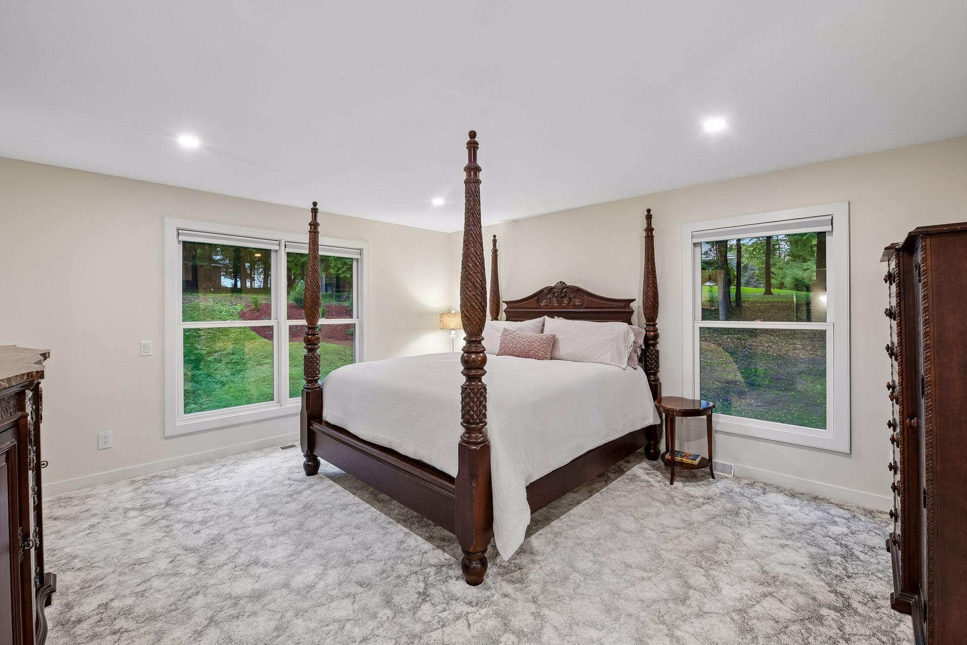 Spacious primary suite features new carpet and abundant natural light