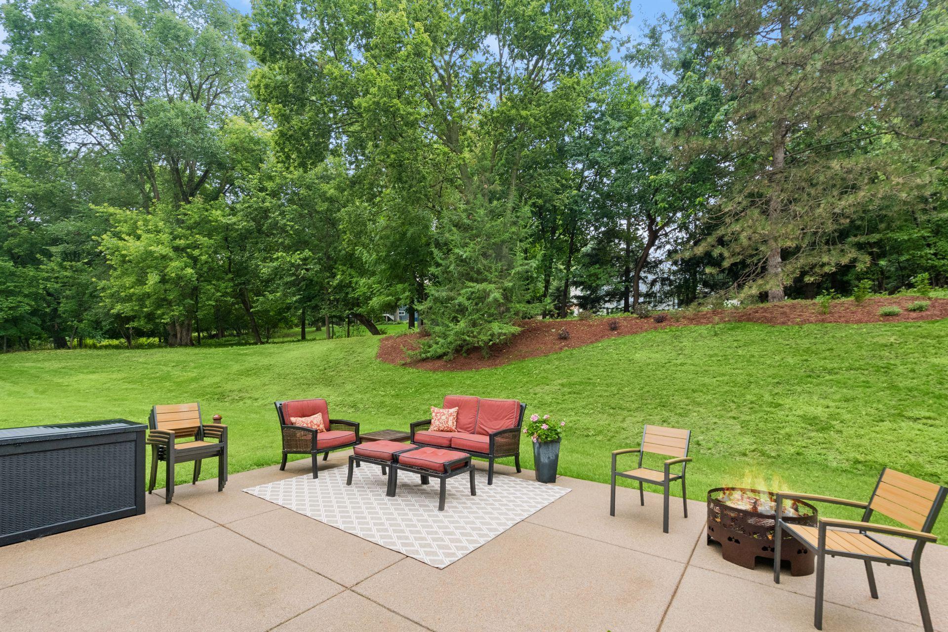 Outdoor patio overlooks the expansive newly landscaped backyard