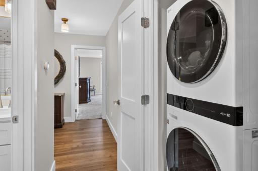 Upper level laundry closet located between the primary suite and 2 additional bedrooms.