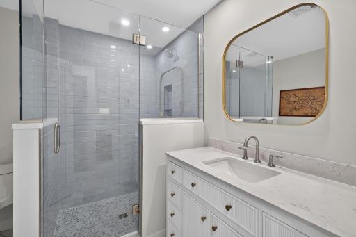 The 3/4 bathroom shared by the 2 bedrooms on this level
