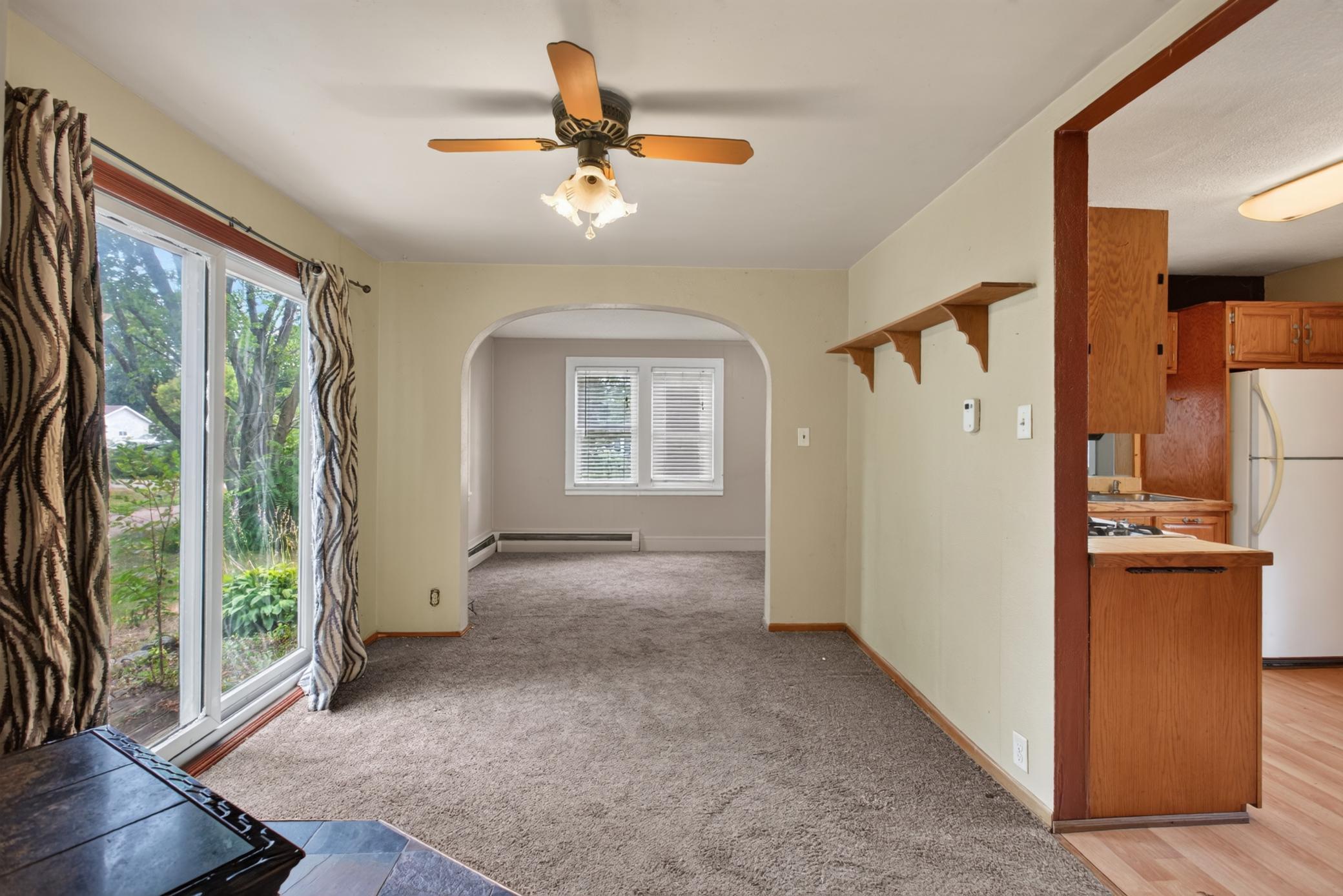 Original picture of dining area to living room where not one structural thing was changed