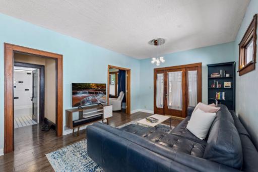 Wide doorways and an easy-flowing floor plan connect the living room to the dining room, bath and inviting front porch.