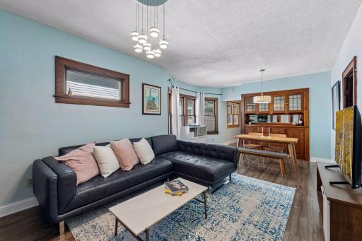 Spacious main-level living and dining areas flow together beautifully, highlighted by original woodwork and a gorgeous built-in buffet.
