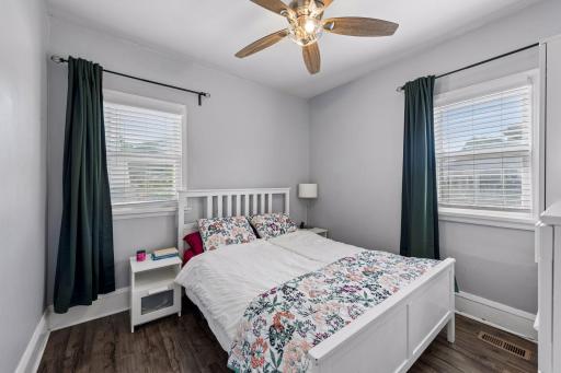 The second of three main-level bedrooms, with two windows bringing in plenty of natural light.