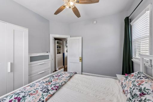A freestanding wardrobe adds practical storage and is included with the home.