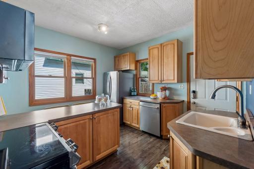 A practical layout, double sink and dishwasher make this kitchen as functional as it is welcoming.