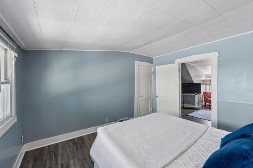 A large closet adds excellent storage to the upper-level bedroom.