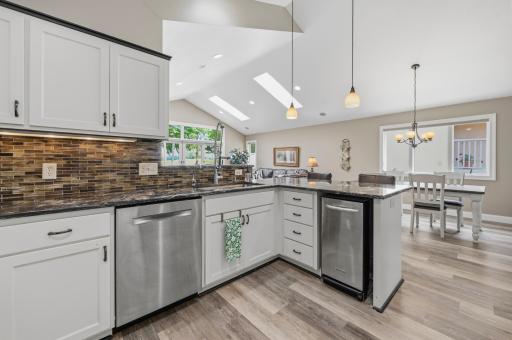 The open kitchen keeps everyone connected while preparing meals or entertaining guests.