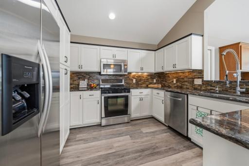 The bright kitchen blends timeless finishes with exceptional functionality.