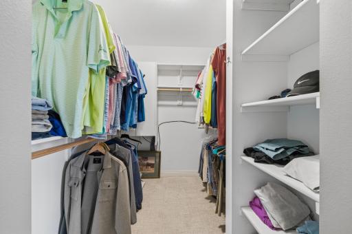 A generous walk-in closet provides exceptional organization and storage.