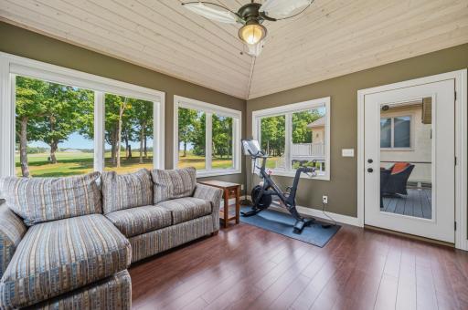The spacious porch invites you to enjoy every season while surrounded by nature.
