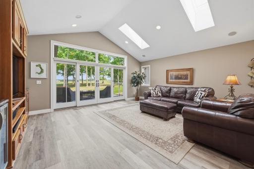 Walls of windows frame peaceful golf course views and fill the living room with natural light.