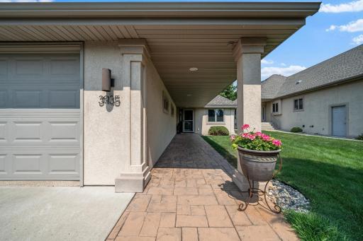 Another view highlights the home's attractive exterior and manicured lawn.
