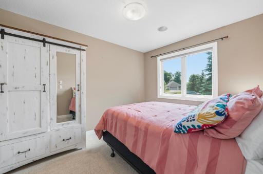 The secondary bedroom offers a welcoming retreat for guests or family.