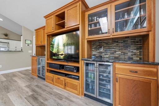 Built-in cabinetry and entertainment space create a warm focal point for the living room.