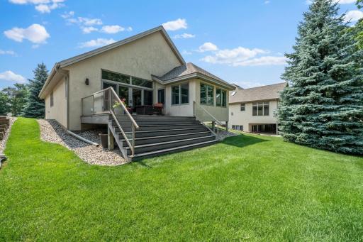 The spacious backyard offers beautiful views of the 5th fairway.