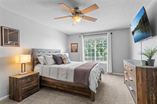 The spacious primary bedroom features a generous 9x7 walk-in closet and direct access to the full bathroom.