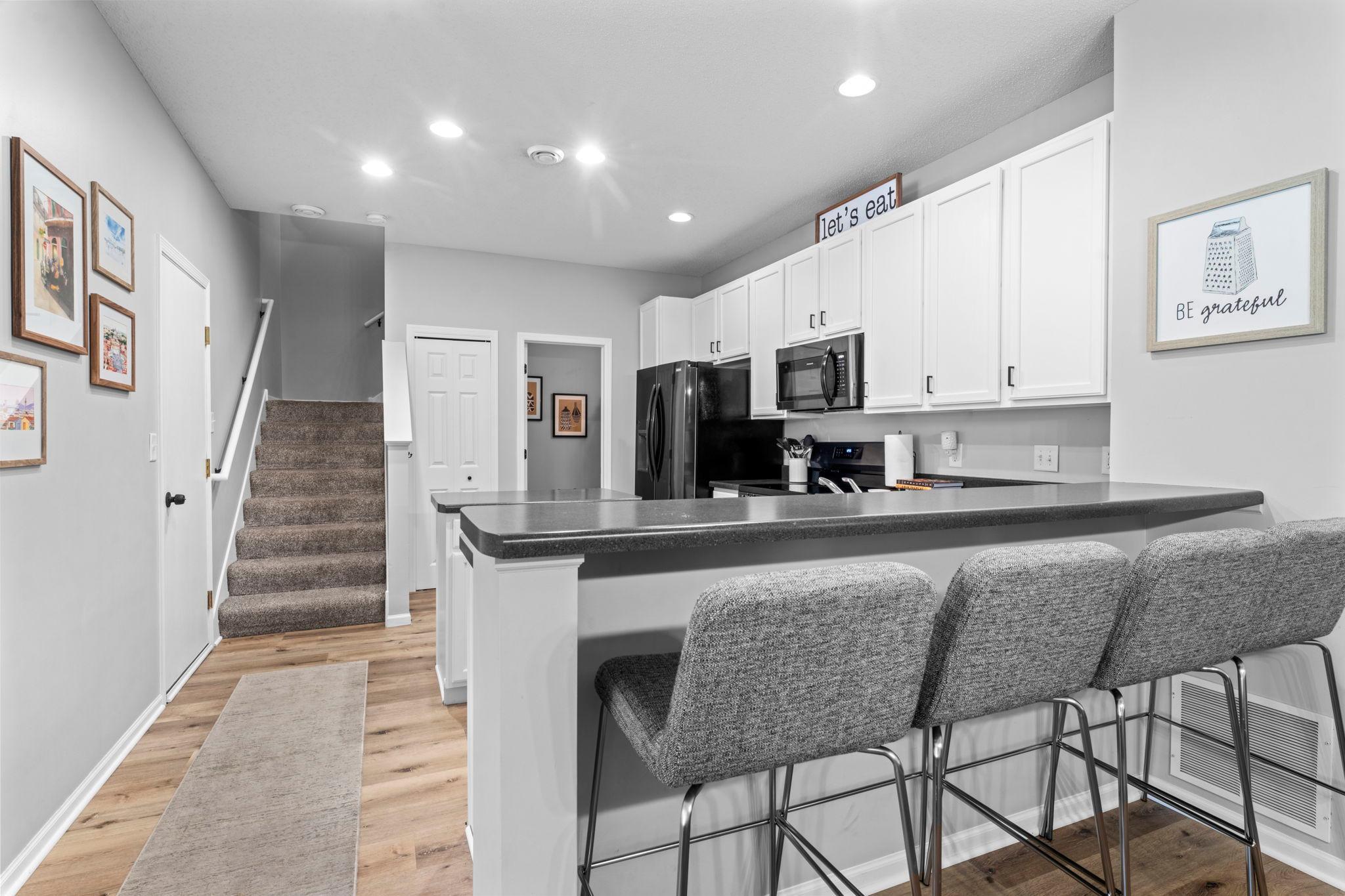 Center island and an oversized 2-tier peninsula for extra prep space, casual seating, or serving.