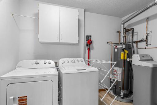 The upper-level laundry area keeps routines conveniently close to the bedrooms, with a new dryer added in 2025.