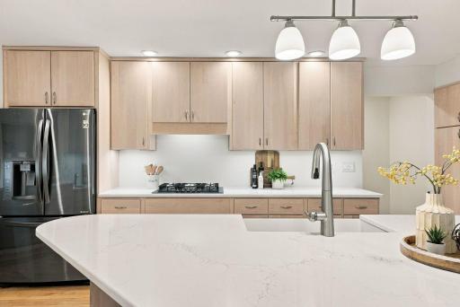 A substantial center island creates a natural hub for cooking, conversation, and everyday life.